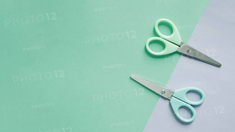 Overhead view two scissors dual colorful background 1