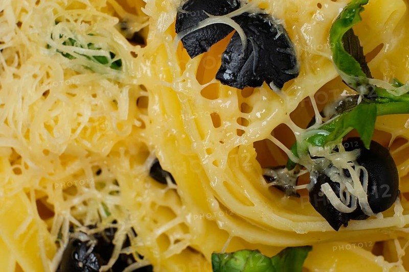Macro photo with shallow depth of field of pasta with parmesan