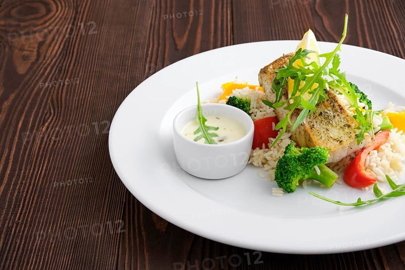 Closeup view of fried zander with rice