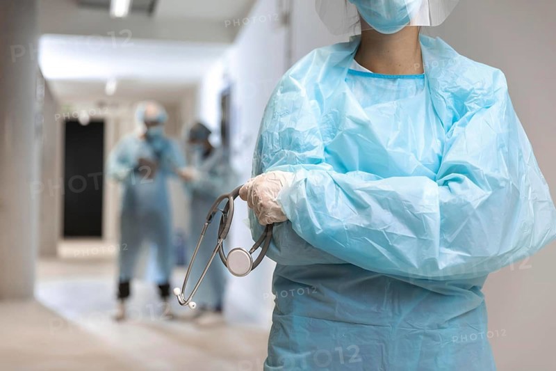 Front view doctor wearing protective wear hospital
