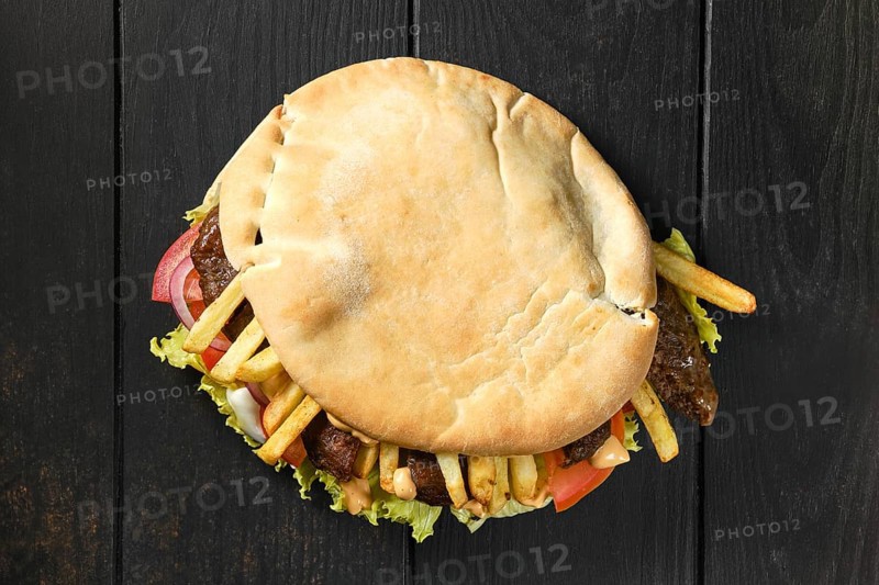 Top view of pitta bread stuffed with salad