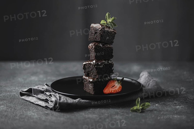Front view chocolate cake pieces plate with mint