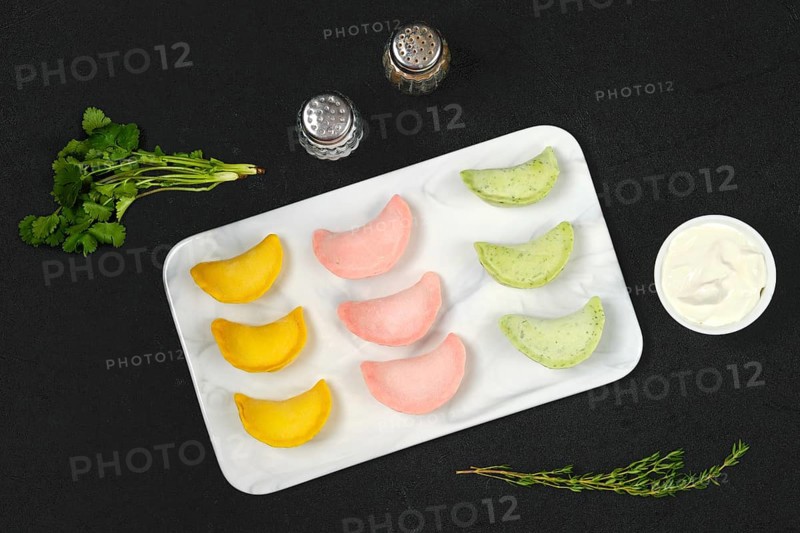 Top view of frozen colorful dumplings with chicken and turkey ground meat