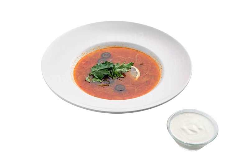 Traditional solyanka sour soup isolated on white background