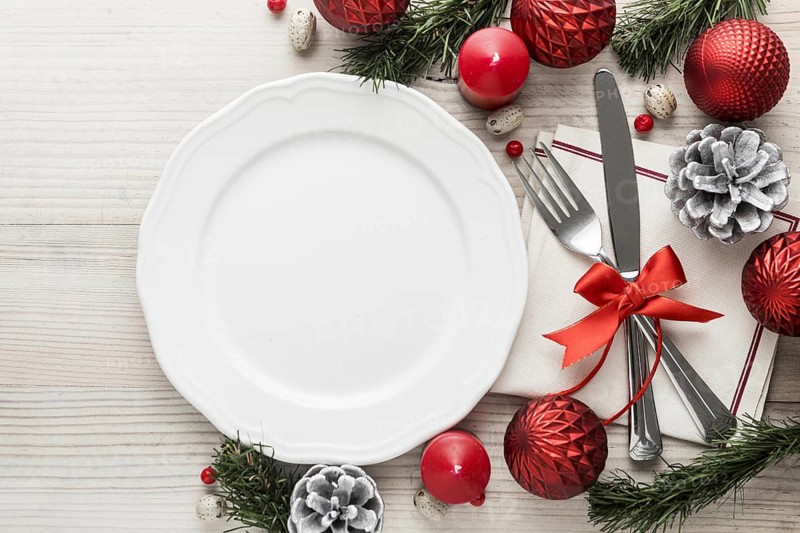 Flat lay christmas tableware with empty plate