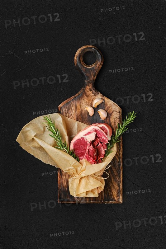 Raw fresh lamb double loin chop wrapped in paper