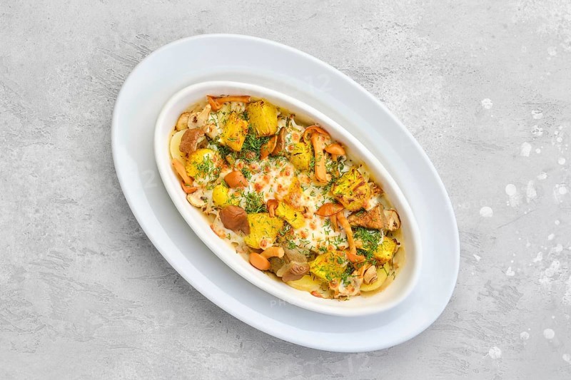 Overhead view of hot casserole with honey agarics