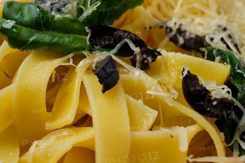 Macro photo with shallow depth of field of pasta with parmesan