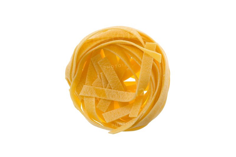 Top view of nest noodles isolated on white background. Italian tagliatelle with egg