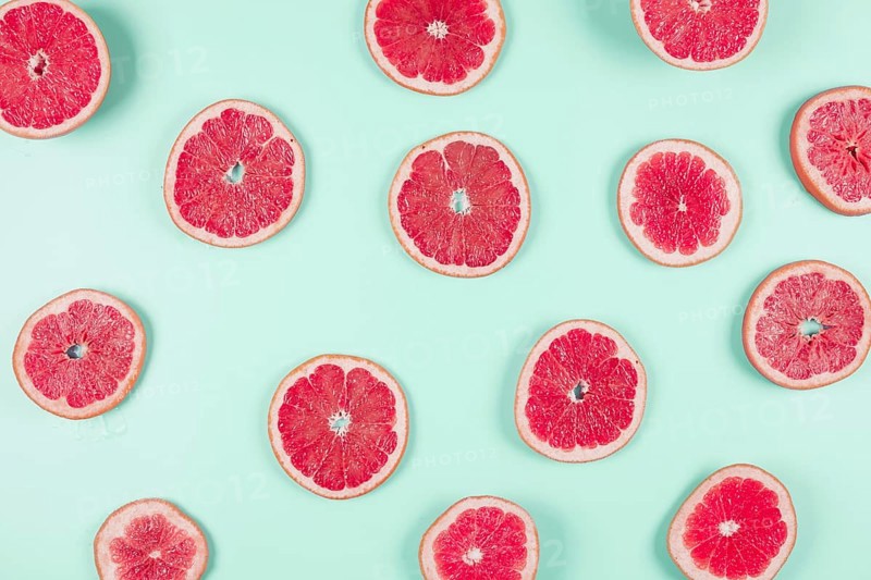 Pattern grapefruit citrus slices pastel backdrop. Resolution and high quality beautiful photo