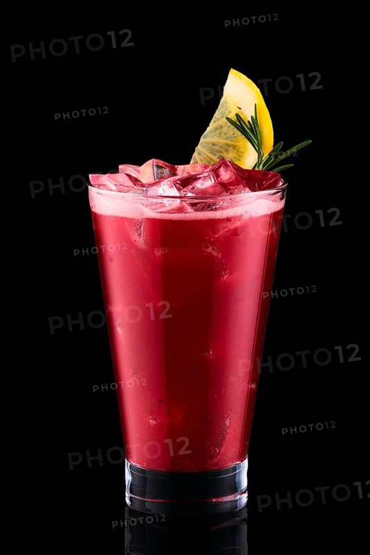Cold fizz cocktail with cherry isolated on black background