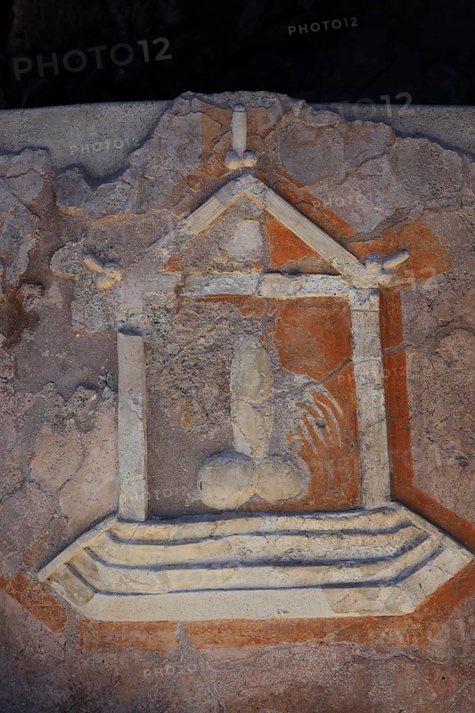 Stone relief of a penis as a reference to the brothel