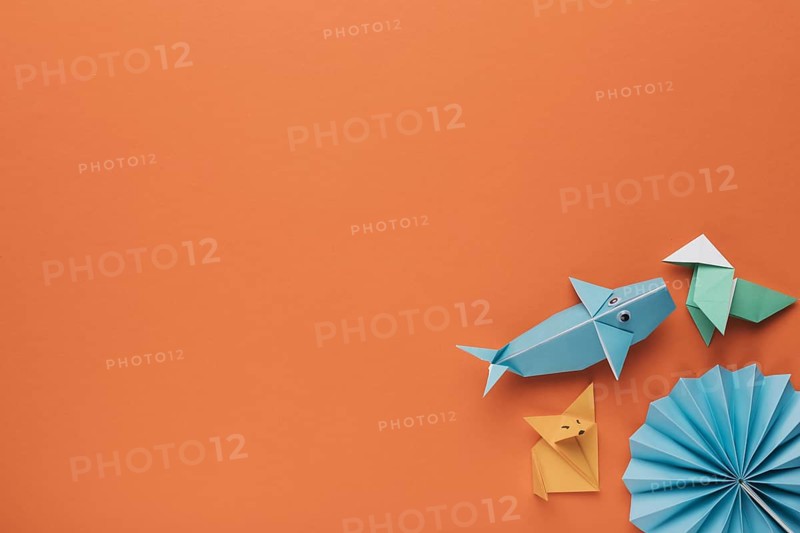 Creative decorative origami art corner orange backdrop