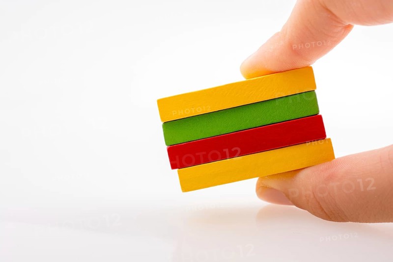 Colorful Domino Blocks in a line on a white background