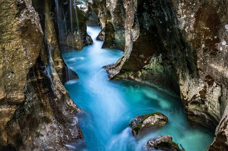 Mountain river Soca flows through narrow canyon