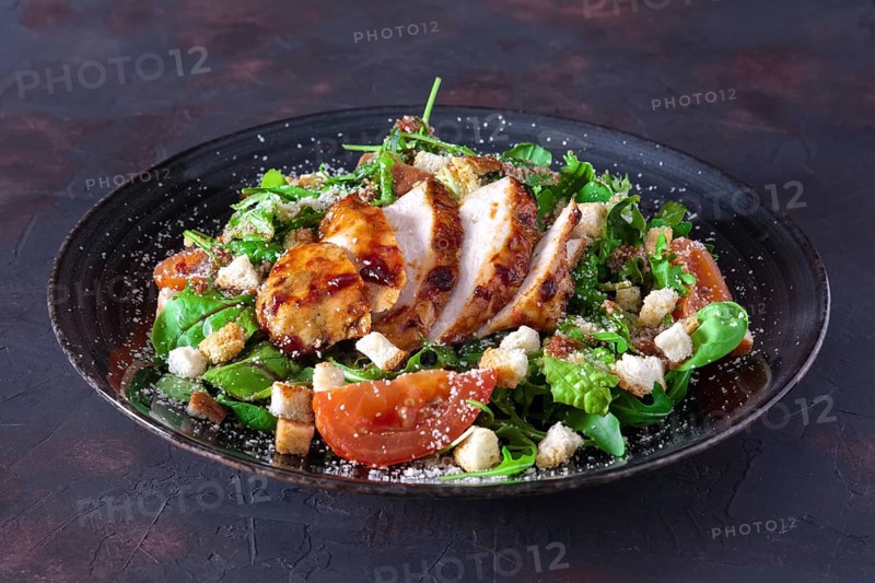Fried turkey fillet with arugula