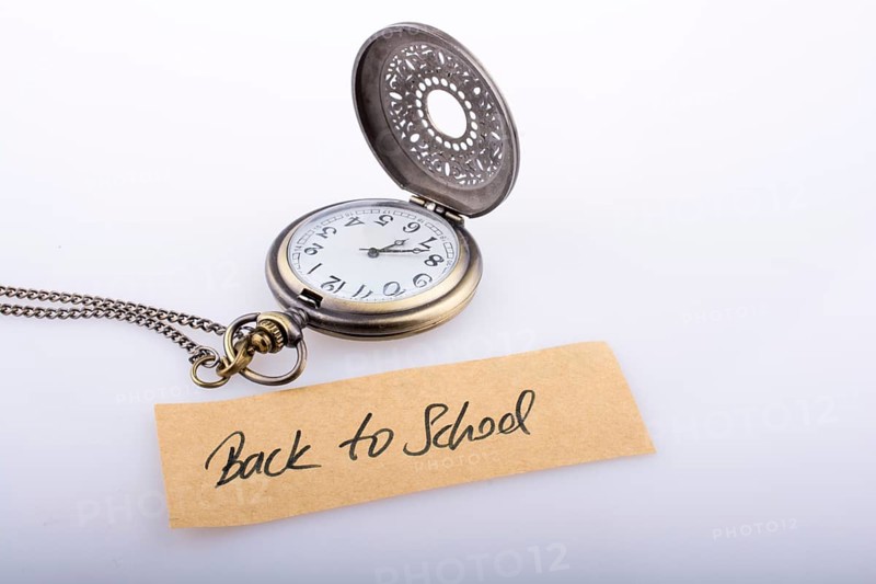 Back to school written title and a pocket watch