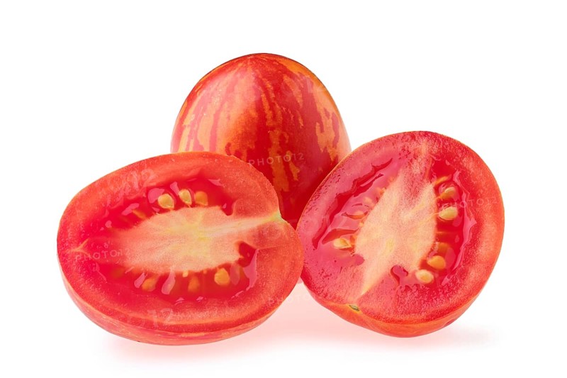 Fresh whole and half tomatoes Russian queen isolated on white background
