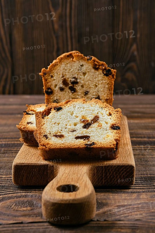 Fresh biscuit cake with raisins on the table closeup