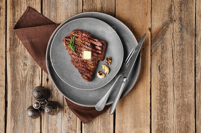 Overhead view of beef steak on a plate
