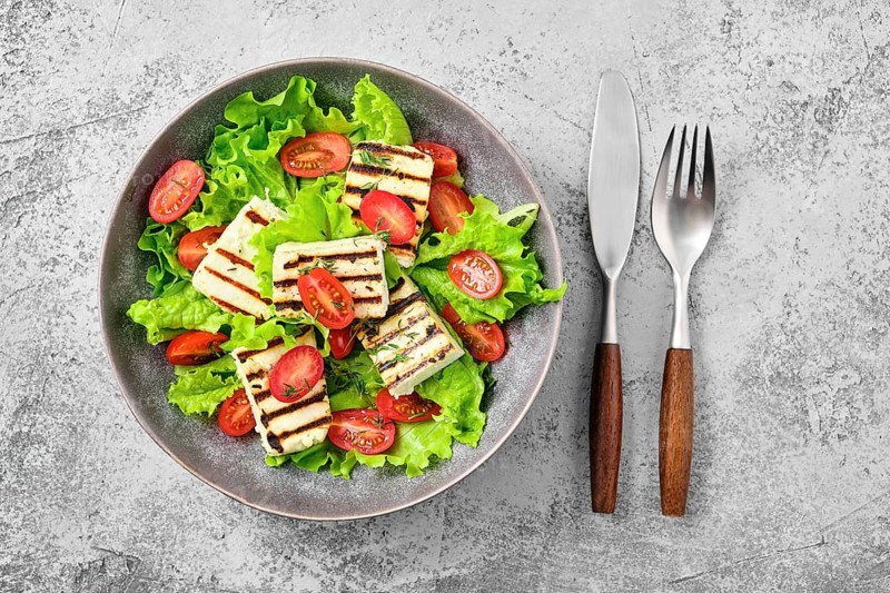 Top view of salad with grilled cheese