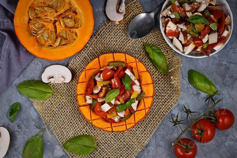 Top view of vegan baked Red Hokkaido squash vegetable filled with bell pepper