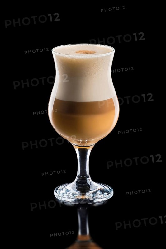 Cup of layered caramel macchiato coffee isolated on black background.