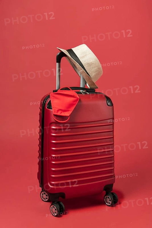 Red luggage with hat mask. Resolution and high quality beautiful photo