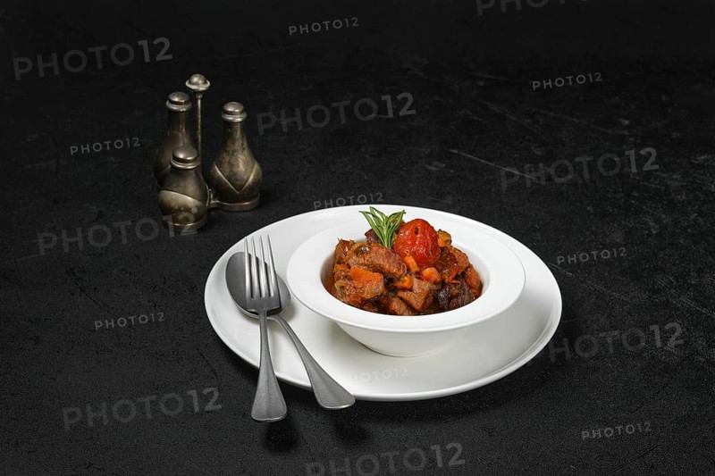 Lamb stew with tomato on a plate