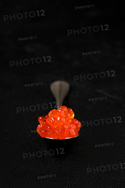 Spoon with salmon red caviar