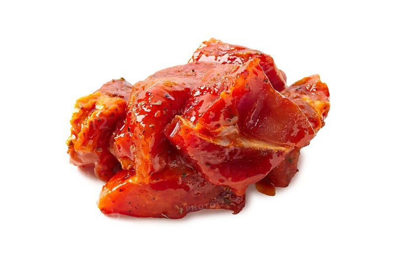 Raw piece of meat with spice and sauce prepered for barbecue. Gastronomy template isolated on white background