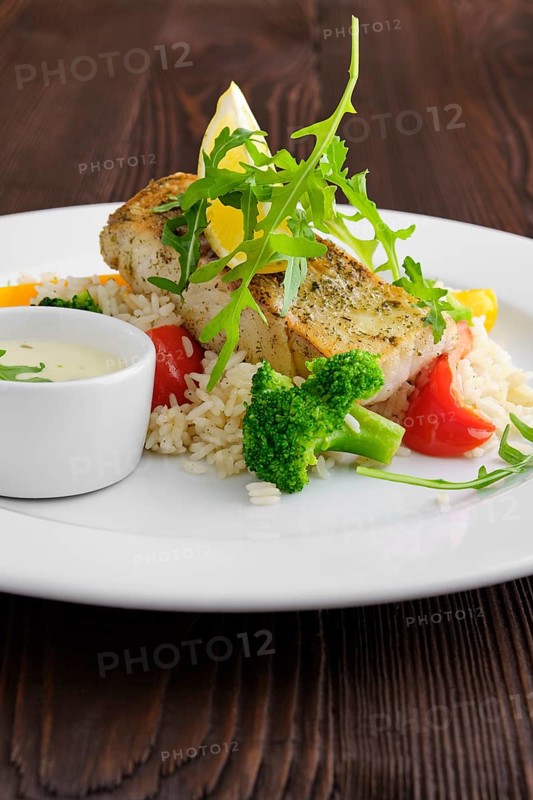 Soft focus photo of fried zander with rice