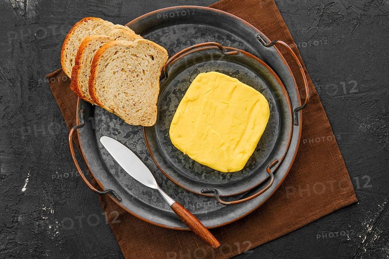 Homemade rustic butter and a spreading knife