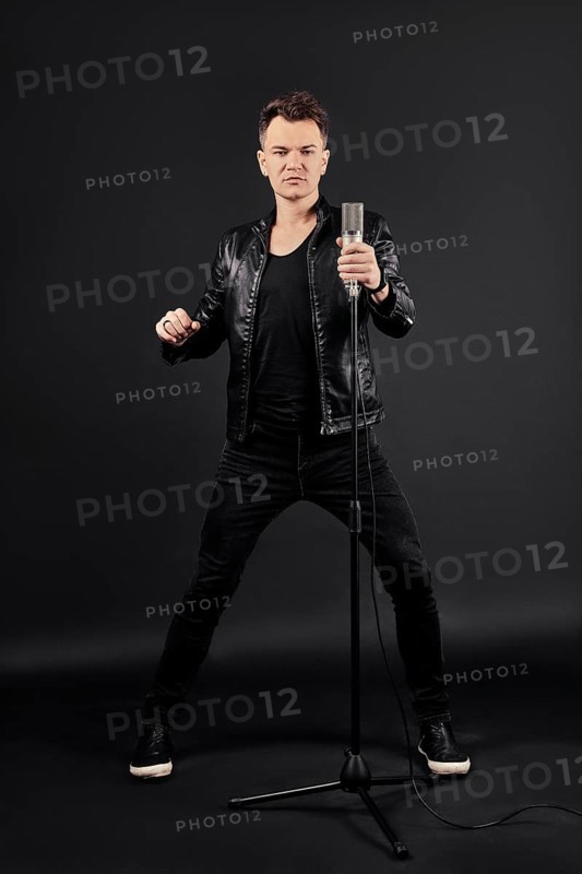 Full length portrait of singing artist