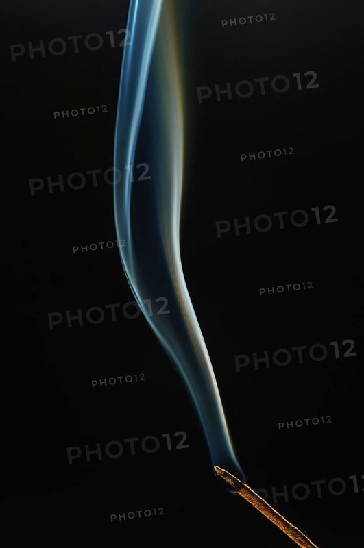 Trajectory of incense smoke in the air showing different shapes. France