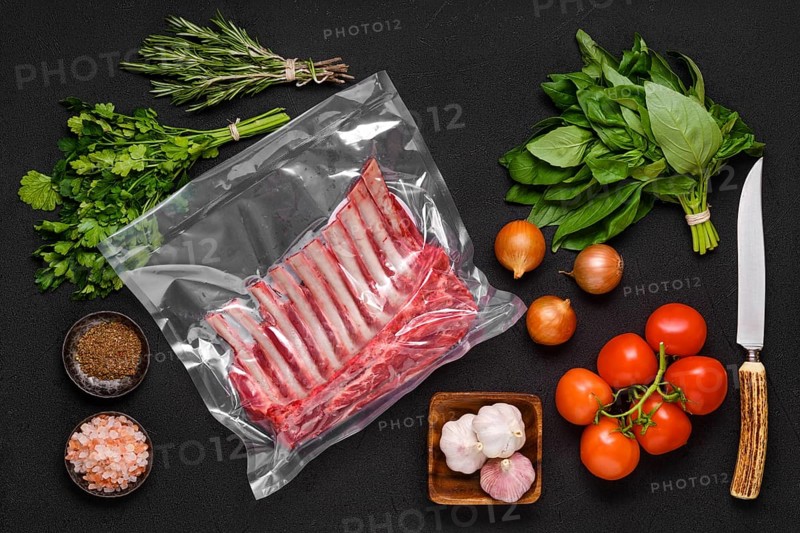 Vacuum sealed lamb ribs with ingredients for cooking
