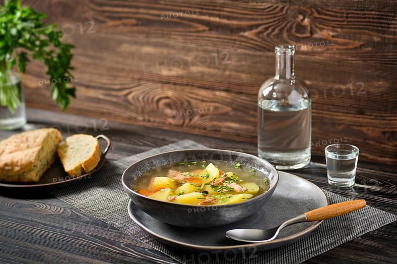 Red salmon fish soup with potato and carrot