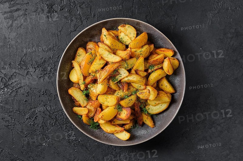 Top view of plate with roasted potato wedges