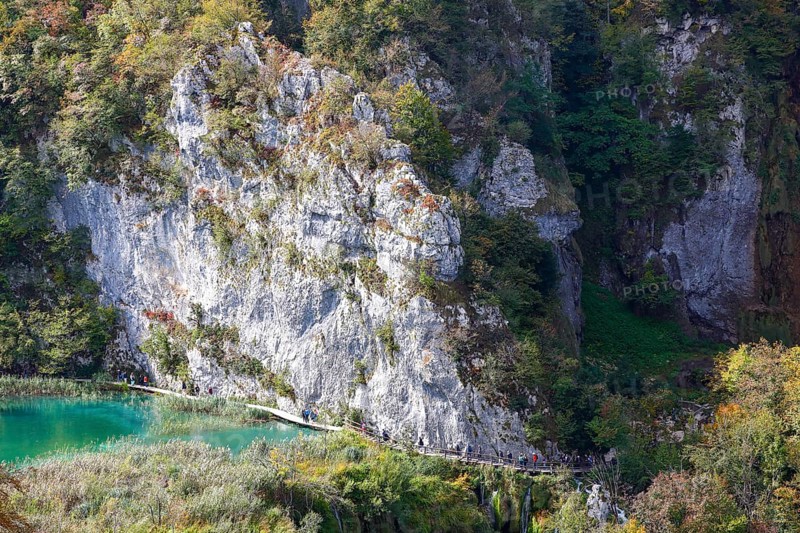 Hikers on wooden footbridge in Plitvice Lakes National Park