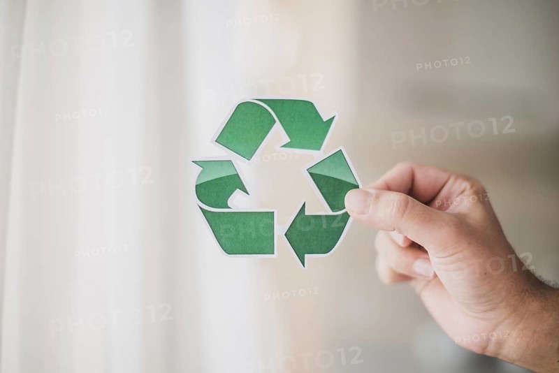 Man s hand showing recycle icon
