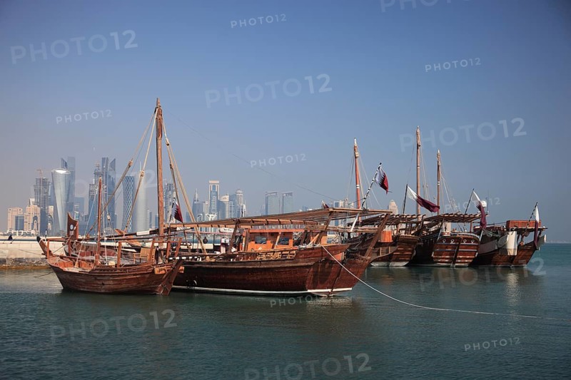 Fishing boats in front of the skyline of Doha