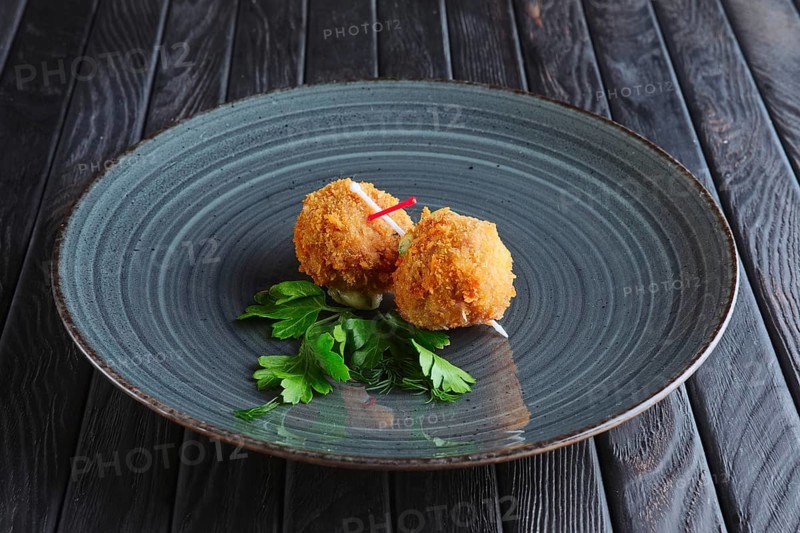 Appetizer for reception. Fried mozzarella balls rolled in bacon in breading