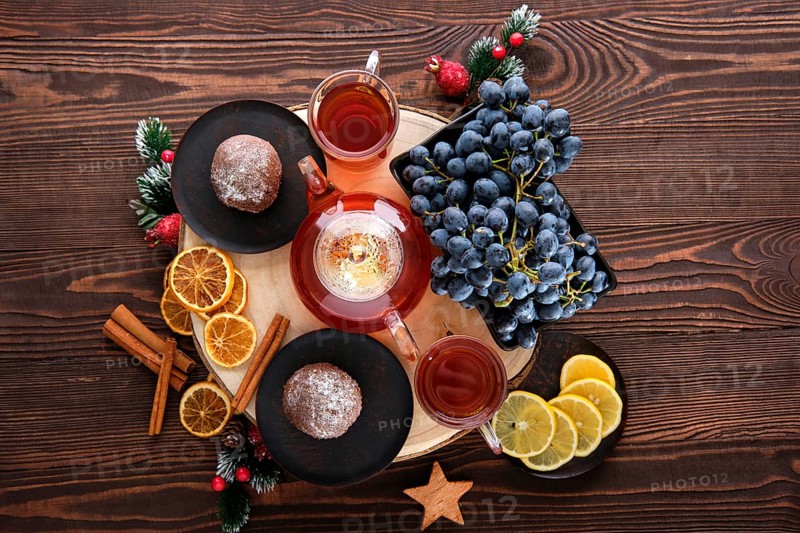 Top view of grape and lemon tea with chocolate cake