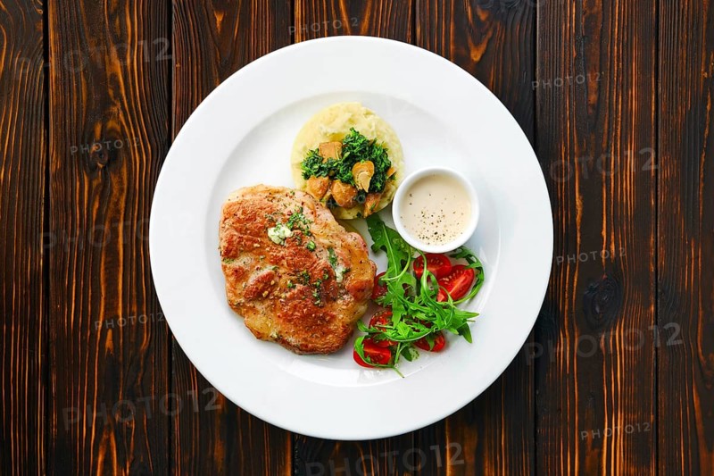 Top view of fried chop pork cutlet with mashed potato and