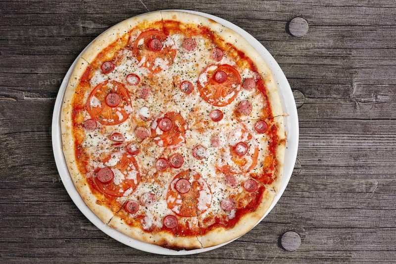 Pepperoni pizza on wooden table