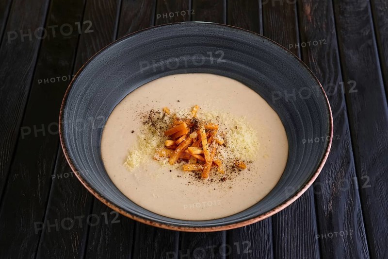 Mushroom soup puree with bacon flakes