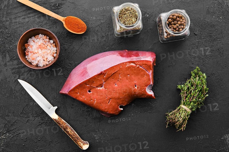 Raw fresh beef liver with spice and herbs