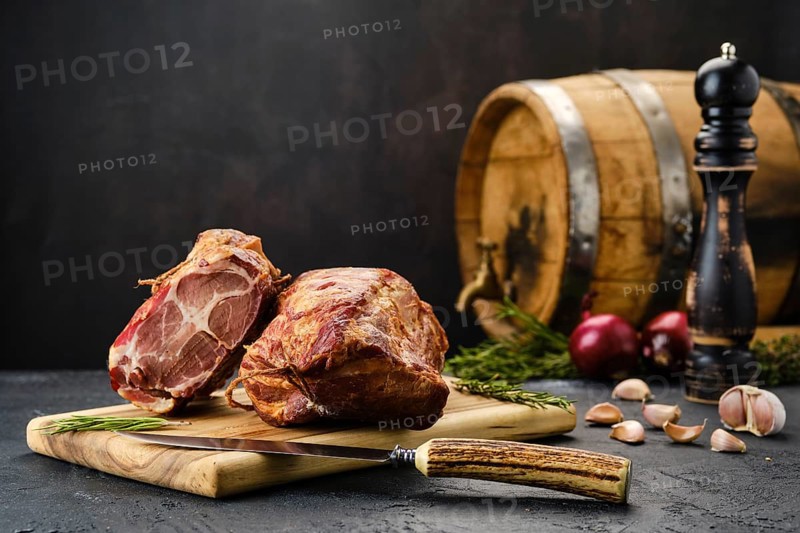 Air dried lamb neck meat on wooden cutting board
