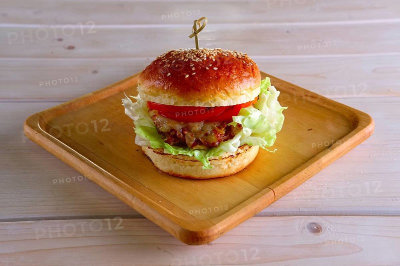 Pulled beef burger on wooden plate