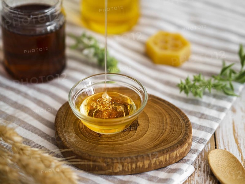 Delicious honey pouring bowl